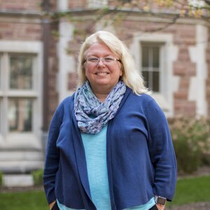 Photo of Deanna Barch in front of a brick building