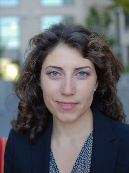 Head shot of Dr. Sepideh Sadaghianni against a blurred urban background