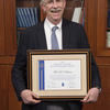 Fred Volkmar holding award