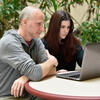 Benjamin and Siler looking at computer